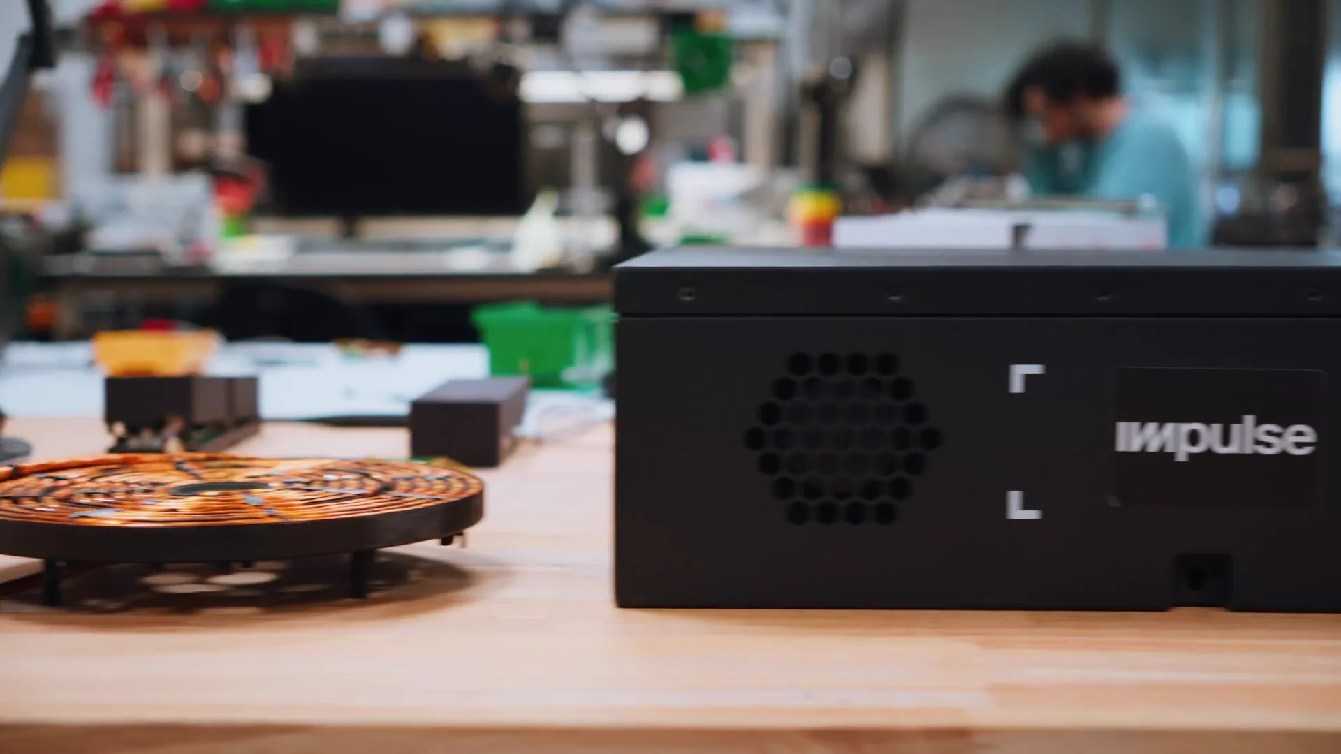 Impulse Core power electronics, battery module and induction coils on a lab bench