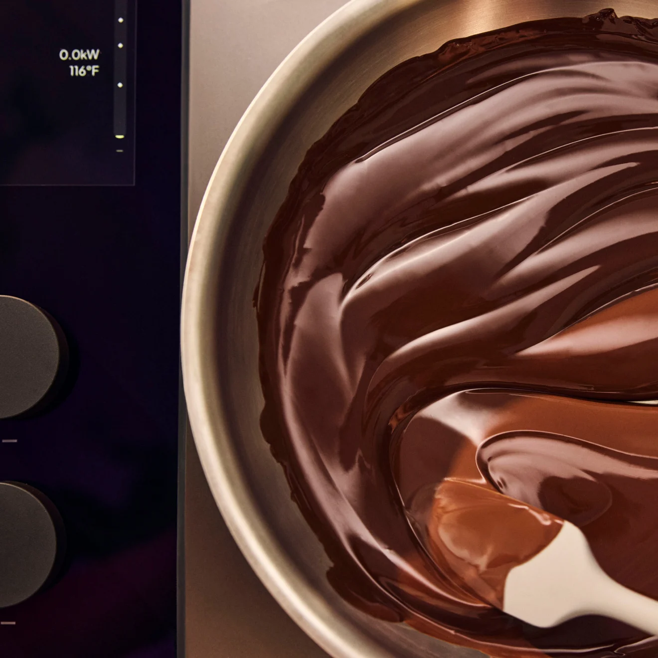 Chocolate held at 116°F beside the cooktop’s display